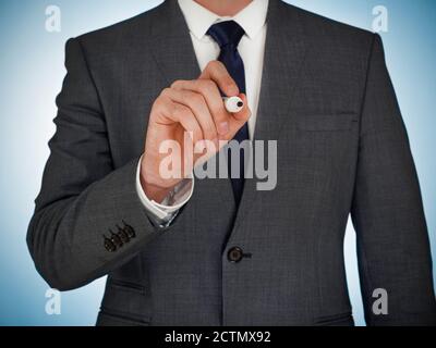 Geschäftsmann mit Stift schreiben Stockfoto