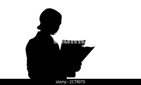 Silhouette seriös nette Geschäftsfrau Lesen von Dokumenten. Stockfoto