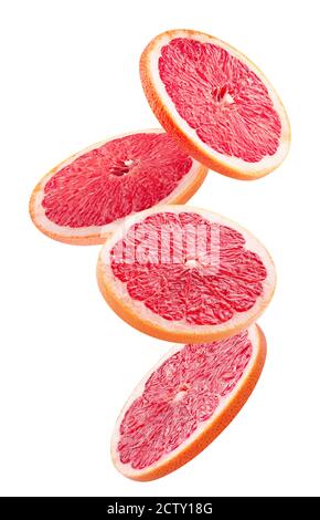 Fallende Grapefruitscheiben isoliert auf weißem Hintergrund. Stockfoto