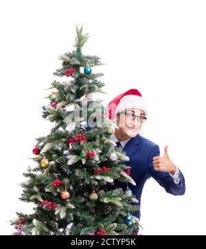 Der Geschäftsmann schmücken Weihnachtsbaum isoliert auf weißem Stockfoto