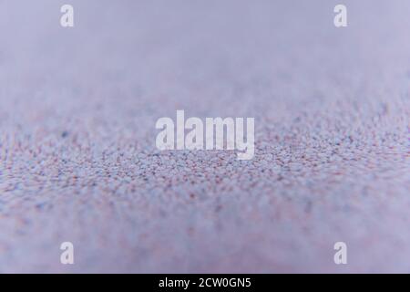 Grobe Kunststoff-Textur Hintergrund Nahaufnahme mit selektivem Fokus. Rosa Struktur. Stockfoto