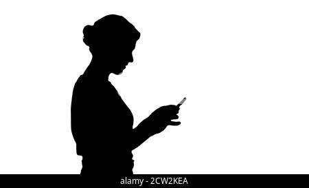 Silhouette hübsche Frau mit Handy. Stockfoto