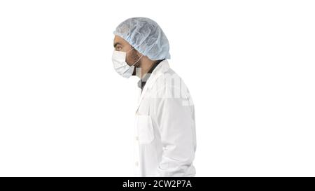 Schöner Arzt trägt seine Uniform und trägt eine Maske er Ist wal Stockfoto