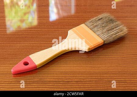 Pinsel mit blauer Farbe auf dem Holztisch, 3D-Rendering Stockfoto