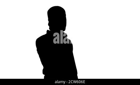 Silhouette ernste arabische Gespräche am Telefon. Stockfoto