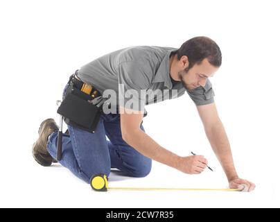 Handwerker mit Maßband Stockfoto