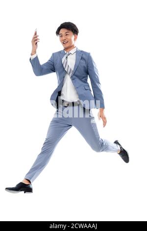 Holen Sie sich das Telefon laufen springen ein Geschäftsmann Stockfoto