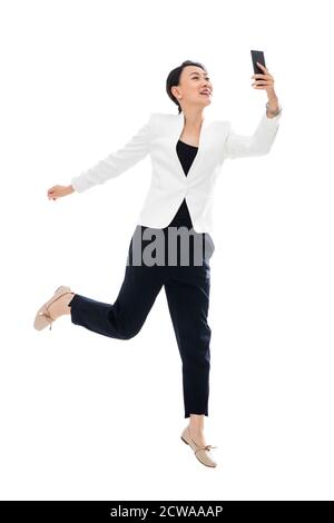 Nehmen Sie das Telefon laufen eine Geschäftsfrau Stockfoto