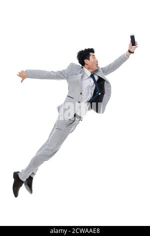 Holen Sie sich das Telefon laufen springen ein Geschäftsmann Stockfoto