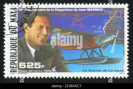 MALI - UM 1986: Briefmarke gedruckt von Mali, zeigt Flugzeuge und Jean Mermoz, um 1986 Stockfoto