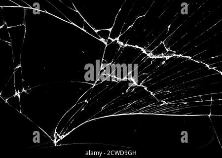 Glas in Rissen auf schwarzem Hintergrund. Stockfoto