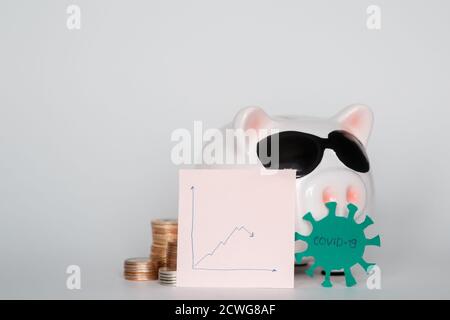 Der Zusammenbruch der Finanzmärkte und die Gefahr finanzieller Einsparungen durch ein Pandemievirus. Stockfoto