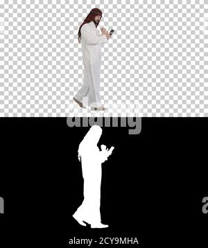 Arab scheich trägt keffiyeh empfangen Rost Nachrichten am Telefon, Stockfoto