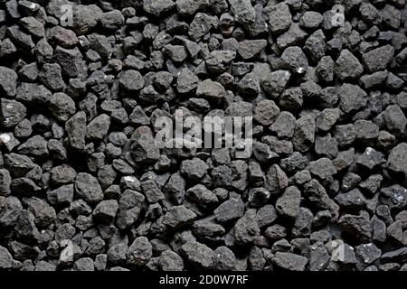 Schwarze kleine Straße Stein Hintergrund, dunkle Kies Kieselsteine Stein Textur nahtlose Textur, Stockfoto