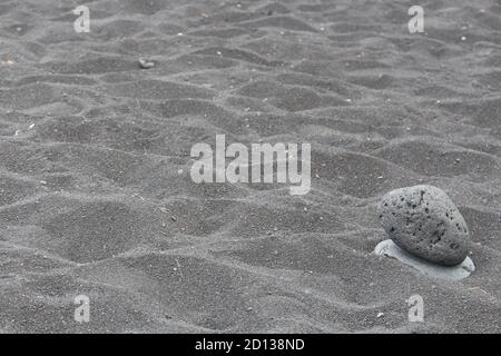 Schwarzem Sand Stockfoto