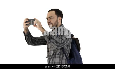 Hübscher junger Mann, der Rucksack trägt und ein Foto von nimmt Er Stockfoto