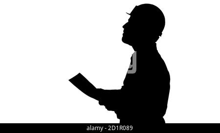 Silhouette Auftragnehmer Ingenieur zu Fuß mit Papieren und Überprüfung Stockfoto