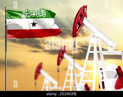 Ölbohrinseln vor dem Hintergrund des bunten Himmels und einer Fahnenstange mit der Flagge von Somaliland. Das Konzept der Ölproduktion, Mineralien, Entwicklung von Stockfoto