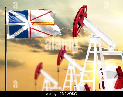 Ölbohrinseln vor dem Hintergrund des bunten Himmels und einer Fahnenstange mit der Flagge von Neufundland und Labrador. Das Konzept der Ölproduktion, Mineralien, Stockfoto