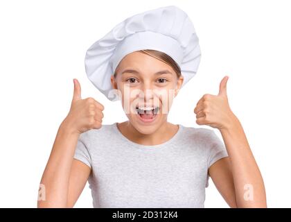 Happy Teenager-Mädchen trägt Chef Hut mit Emotionen, die Zeichen mit Händen, isoliert auf einem weißen Hintergrund. Stockfoto