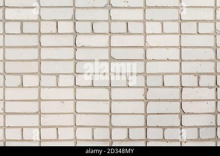 Vorderansicht der weißen Backsteinmauer Hintergrund und Textur Stockfoto