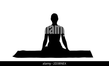 Silhouette Sportliche attraktive Frau Yoga üben, sitzen in L Stockfoto