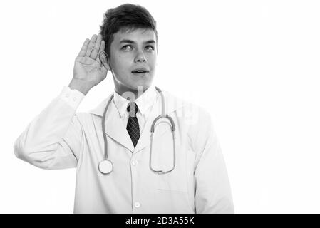 Studio shot Junger stattlicher Mann Arzt hören Stockfoto