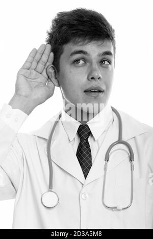 Studio shot Junger stattlicher Mann Arzt hören Stockfoto