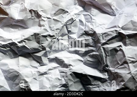 Nahaufnahme Weiße zerknitterte Papierstruktur. Flach liegend, Draufsicht Stockfoto