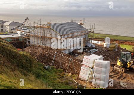 Die Arbeiten auf dem Ogmore by Sea Village Gemeindezentrum gehen zügig voran, mit fast wasserdichten Mauerwerk und Überdachung und dem Guss der Bodenplatte. Stockfoto