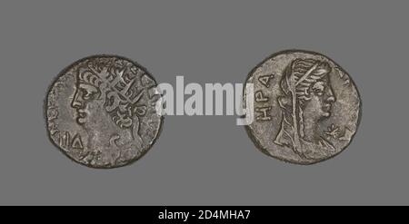 Die Vorderseite (Vorderseite) dieser Münze zeigt die Büste von Kaiser Nero nach links strahlenden mit einer Brusttasche (Brustschild) ''L lâˆ†'' vor. Auf der Rückseite (Rückseite) ist eine Büste der Göttin Hera Argeia nach rechts mit einem Stern davor verschleiert dargestellt. Das Datum, an dem diese Münze geprägt wurde, ist in der Vorderseite Inschrift angegeben '' LI âˆ† '' was bedeutet, das vierzehnte Jahr von Neroâ €™s Herrschaft oder 67-68 CE. Nero regierte als Kaiser von 54-68 u.Z. Stockfoto