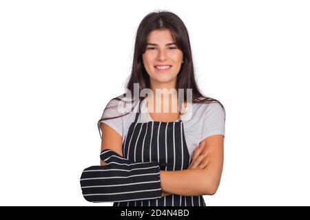 Portrait einer schönen Küchenchefin, die eine gestreifte Schürze trägt und Küchenutensilien im Studio hält. Küche und Kochkonzept. Stockfoto