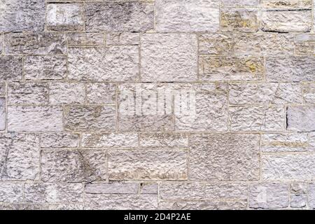 Alte, rustikale weiße oder beige Ziegelwand oder Steinmauer. Hochwertige Textur und Hintergrund für Ihre Projekte und kreative Arbeit Stockfoto