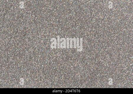 Silberfarbener funkelnder Hintergrund. Foto mit geringem Kontrast. Stockfoto