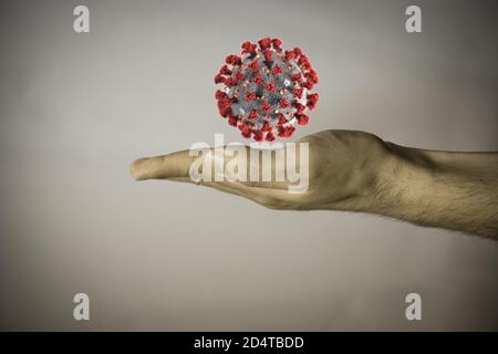 Menschliche Hand auf vintage Hintergrund, um Stärke gegen covid auszudrücken Stockfoto