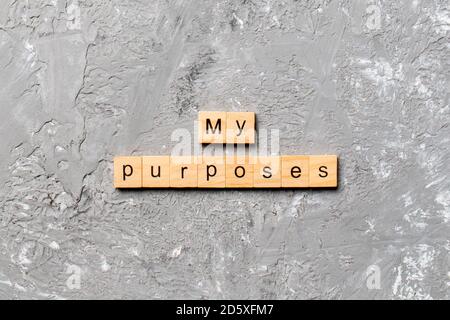 Meine Zwecke Wort auf Holzblock geschrieben. Meine Zwecke Text auf Zementtisch für Ihr Design, Konzept. Stockfoto