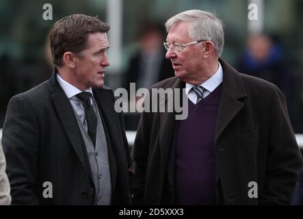 AP McCoy und Sir Alex Ferguson während des zweiten Tages Das internationale Treffen auf der Pferderennbahn Cheltenham Stockfoto