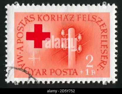 UNGARN - UM 1952: Briefmarke gedruckt von Ungarn, zeigt Telegrafenmast, um 1952 Stockfoto