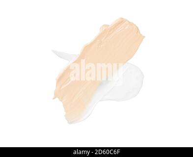 Farbkorrekturstriche isoliert auf weißem Hintergrund. Beige und weiße Farbe Korrektur Creme Concealer wisch Verwischen Farbmuster. Make-up-Fundament Stockfoto