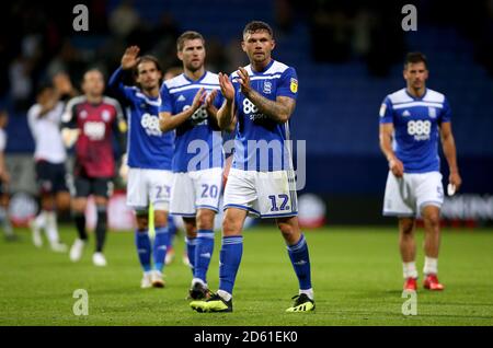 Harlee Dean (vorne) von Birmingham City applaudiert den Fans im Ende des Bolton Wanderers gegen Birmingham City Spiel bei Das Stadion der Universität von Bolton Stockfoto