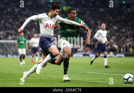 Tottenham Hotspur's Son Heung-min (links) und Brighton & Hove Albion's Bernardo Kampf um den Ball Stockfoto