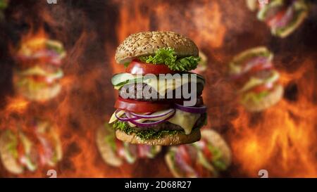 Hamburger fallen mit Rauch und brennendem Feuer im Hintergrund. Sonderangebot für Fast Food-Menüs Stockfoto