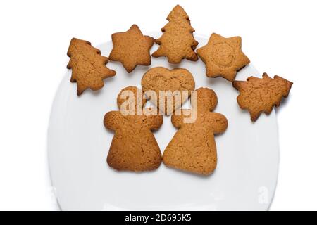 Gebackene Lebkuchen auf einem weißen Teller isoliert auf weiß Stockfoto