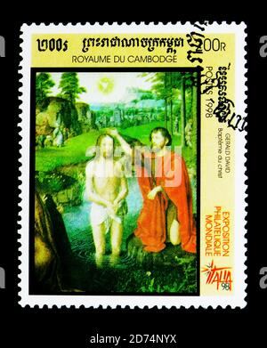 MOSKAU, RUSSLAND - 24. NOVEMBER 2017: Eine in Kambodscha gedruckte Briefmarke zeigt die Taufe Christi von G. David, Internationale Briefmarkenausstellung 'Italia '98' - Mi Stockfoto