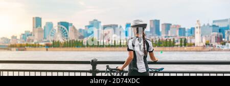 Radfahren im Freien Radfahrer auf Radweg am alten Hafen von Montreal Blick Stadtbild Panorama-Banner. Frau auf dem Fahrrad trägt Helm. Sommer-Sportstadt Stockfoto