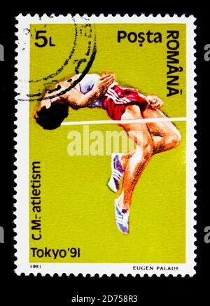 MOSKAU, RUSSLAND - 25. NOVEMBER 2017: Eine in Rumänien gedruckte Briefmarke zeigt Hochsprung, Leichtathletik-Weltmeisterschaften, Tokyo Serie, um 1991 Stockfoto