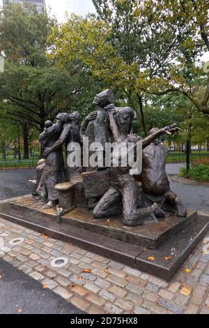 Die Immigranten-Statue im Battery Park Manhattan NYC Stockfoto