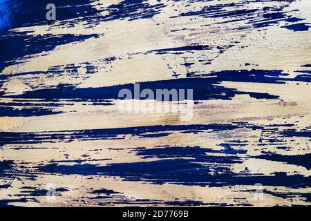 Gold potal Hintergrund oder Textur. Abstrakt glänzende Pinselstriche auf Blau Stockfoto