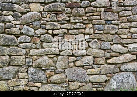 Traditionelle Trockensteinwand Hintergrund. Stockfoto