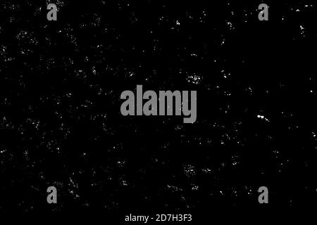 Chaotisches weißes Bokeh auf schwarzem Hintergrund. Lichtflecken Textur, Abstraktion. Fallender Schnee. Sternenhimmel. Stockfoto